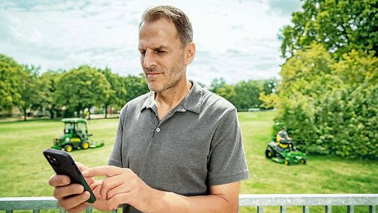 man using a precision turf app