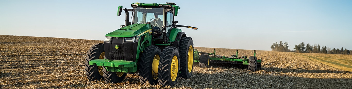 High-horsepower 8R Series Tractor tilling a field.
