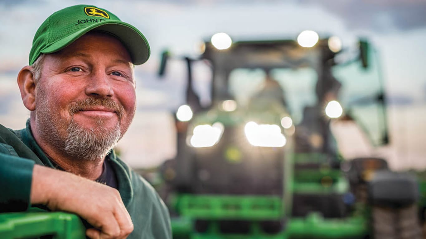 man in front of tractor