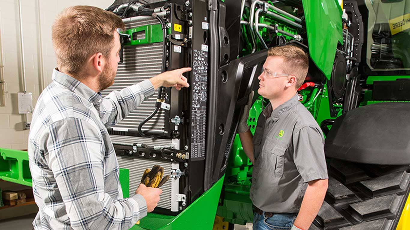 men looking at engine