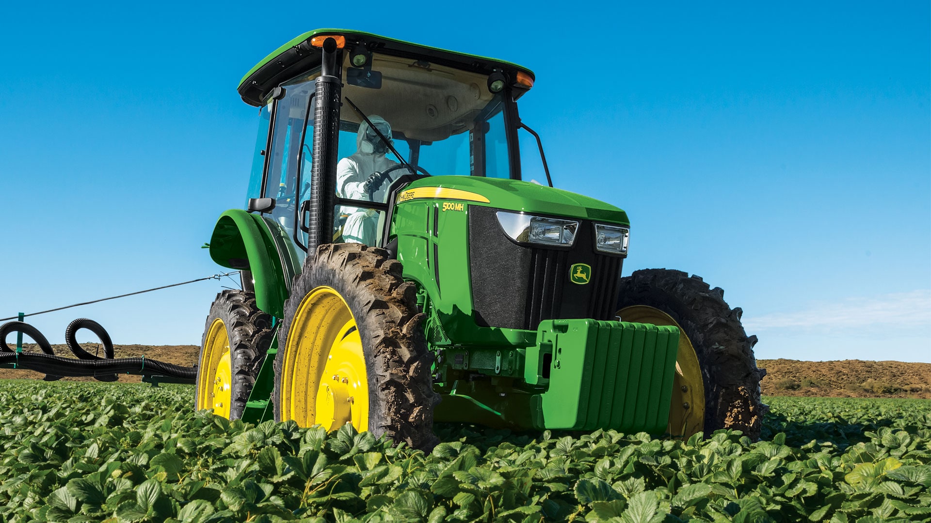 Compact speciality tractor working in the field