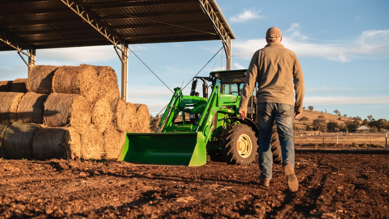 Man on utility tractor